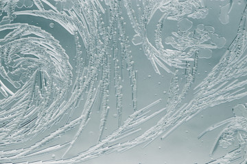 Snow patterns on glass as an abstract background