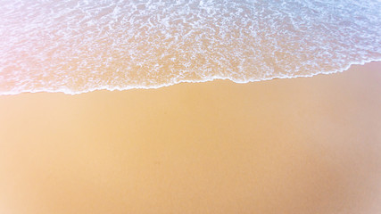 Fototapeta na wymiar Soft wave of blue sea on beach.Wallpaper Background