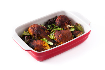 Roasted tandoori chicken with herbs isolated on white background