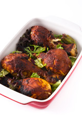 Roasted tandoori chicken with herbs isolated on white background