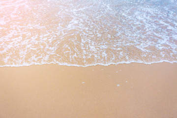 Fototapeta na wymiar Soft wave of blue sea on beach.Wallpaper Background