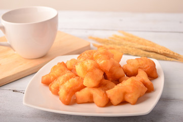 Chinese traditional food, deep fried bread stick normally eaten with rice porridge ,white sugar sponge cake, 