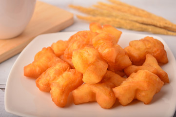 Chinese traditional food, deep fried bread stick normally eaten with rice porridge ,white sugar sponge cake, 