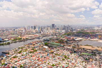 Cityscape Manila. Residential areas and business center in the city, top view. Big port city. The capital of the Philippines.