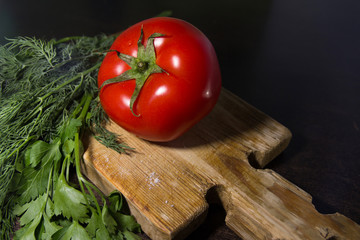tomato on wooden board