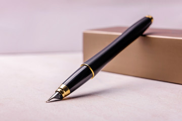 Black pen with gold and original packaging