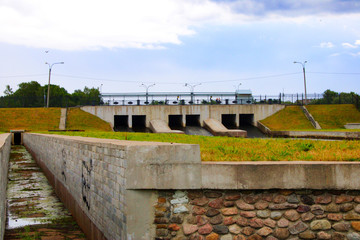 Fototapeta na wymiar old dam with the floodgates closed