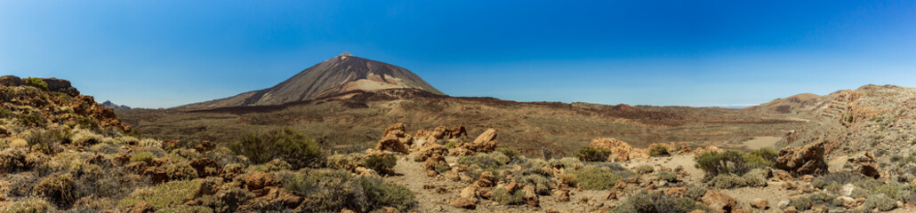 Magnificent panoramic view from the height at the edge of the mountain range around the volcano Teide. National park. Tenerife, Canary Islands, Spain