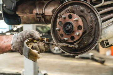 Photo of repair of a running gear of the car hands