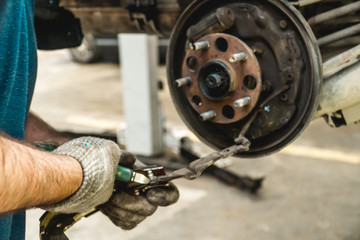Photo of repair of a running gear of the car hands