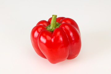 Ripe red bell pepper isolated on white