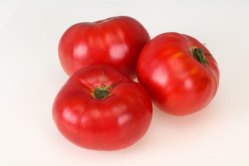 Red ripe tomato isolated on white