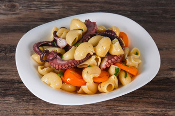 Pasta with octopus and yellow tomatoes