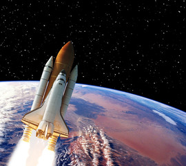 Rocket above earth. Stars and outer space. The elements of this image furnished by NASA.