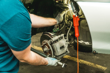 Photo of repair of a running gear of the car hands