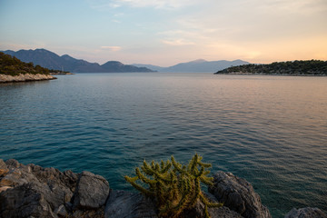 Summertime evening beautiful view from the beach of Aponissos, Agistri island, Saronic gulf, Greece.