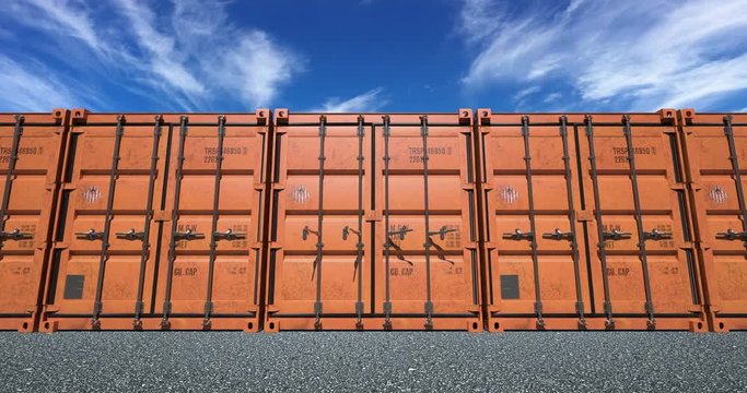Empty cargo shipping container doors opening towards camera. Bright sunny day with light cirrus clouds in the sky.