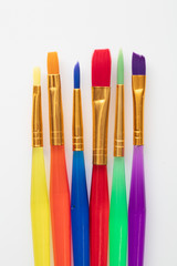 Colourful creative paintbrush art supply background