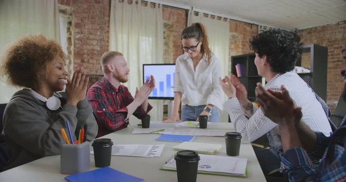 Businesspeople Clapping For Boss After Presentation