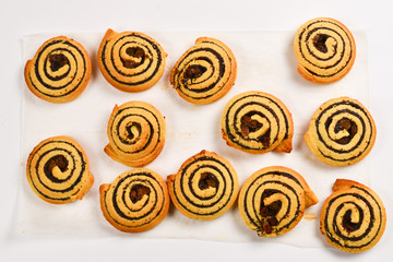 Baked cookies with raisins and poppy seeds isolated on white background.