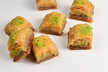 Pistachio baklava on a white background. Dessert.