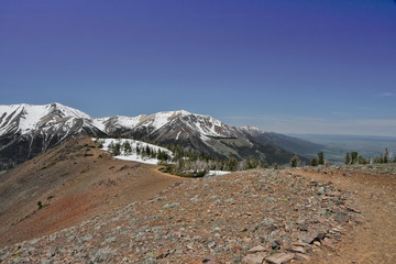 hiking on a hog back mountain in the melted snow