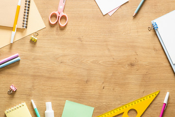 Flat lay school stationery on a wooden background. Back to school concept, creative layout. Top view, overhead. - Powered by Adobe