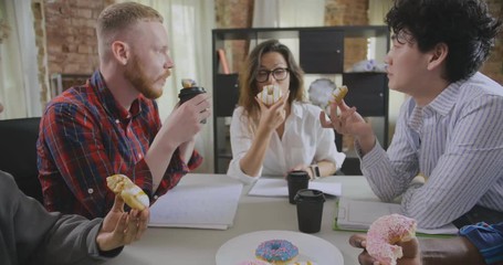 Business coworkers having coffee break in office