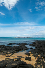 Lava beach in Hawaii with blue sky