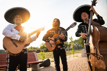 Mexican musicians mariachi band street concert