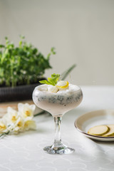 Vanilla ice cream decorated with caramel and mint on the table