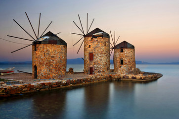 Beautiful windmills right by the sea in Chios town, Chios island, North Aegean, Greece 