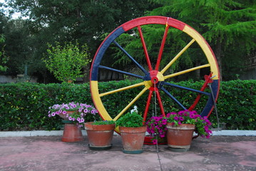 Fototapeta na wymiar big wooden wheel with colours