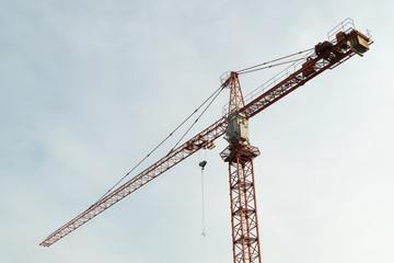 Construction crane with blue sky background.