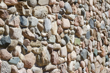 Natural rock stone wall background  (side angle view)