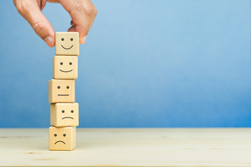 Customer service evaluation and satisfaction survey concepts. The client's hand picked the happy...