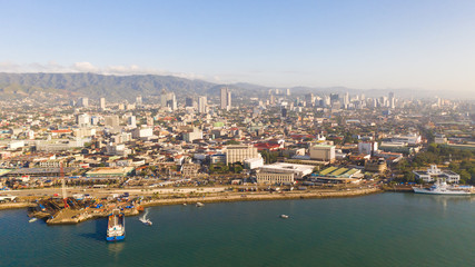 Cityscape in the morning. The streets and houses of the city of Cebu, Philippines, top view. Panorama of the city with houses and business centers.