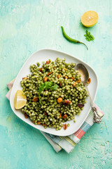 Hariyali sabudana khichdi is a delicious twist to the regular Sago khichadi made using cilantro , chillies and groundnuts