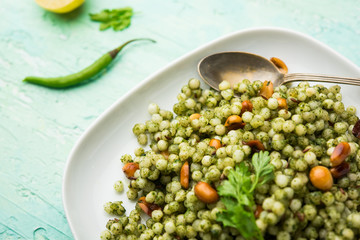Hariyali sabudana khichdi is a delicious twist to the regular Sago khichadi made using cilantro , chillies and groundnuts