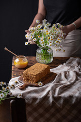  girl preparing honey cake on the kitchen table