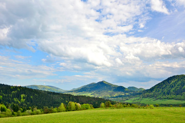 Fototapeta na wymiar Beautiful summer landscape in the mountains with green meadows and forested hills, Low Beskids (Beskid Niski). 