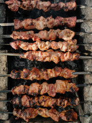 Beef steaks on the grill with flames