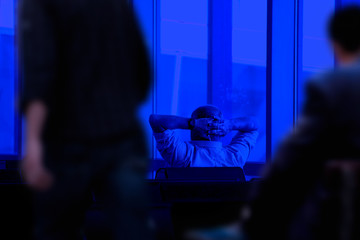 mid adult man sitting in waiting area of airport