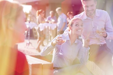 Business people on a rooftop party.
