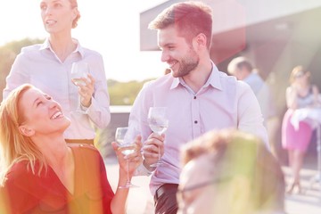 Business people on a rooftop party.