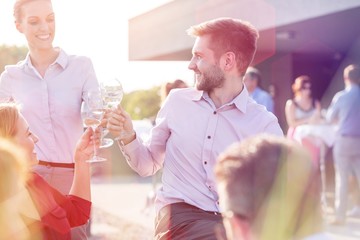 Business people on a rooftop party.