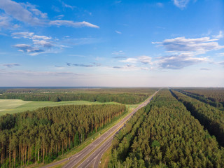 Nature in the summer. Forests, fields, meadows, lake, river and village. View from the sky. The photo was taken by a copter. Panorama. The concept is a favorable environment. Blue sky. Background.