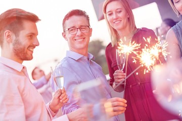 Business people on a rooftop party.