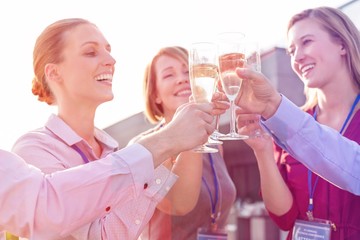 Business people on a rooftop party.
