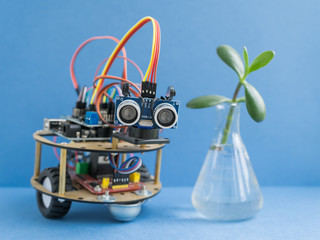 Back to school concept. A metal robot. Robotics and electronics. DIY robotics. STEM and STEAM education for kids. Free space for text.